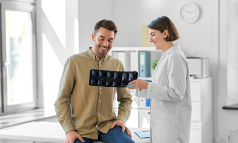 Doctor discussing X‑ray scan with patient